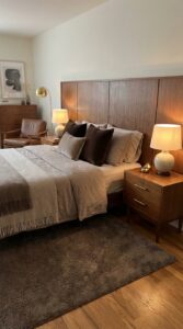 Dark taupe bedroom with wood panel headboard