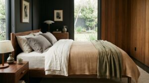 Neutral bedding in dark mid century bedroom